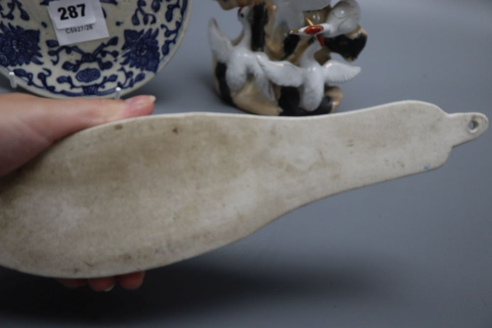 A Chinese blue and white dish, a wall pocket and a bird group, tallest 26cm